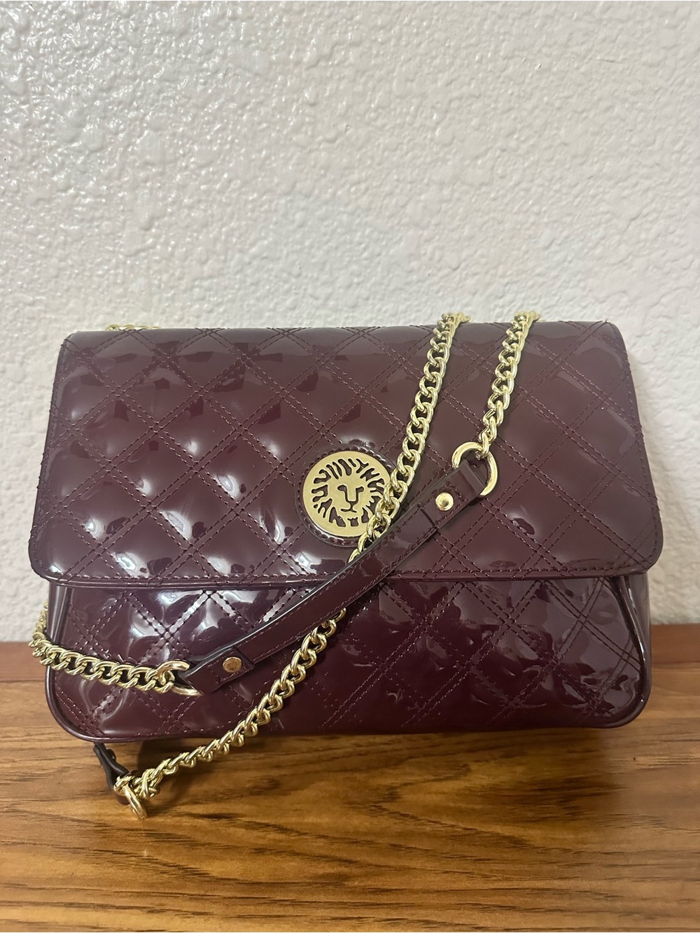 Quilted Patent Shoulder Bag with Lion Emblem - Burgundy
